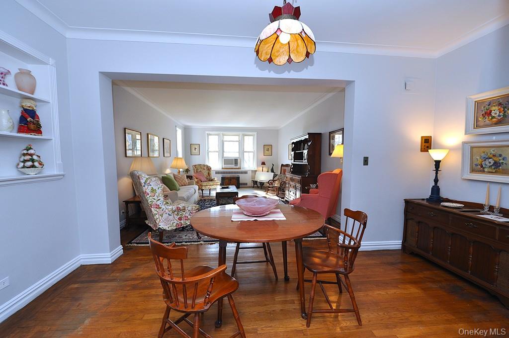 949 Palmer Road, Unit 6H Bronxville, NY 10708 - Photo 19 of 48 a view of a dining room with furniture and wooden floor