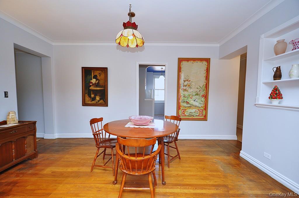 949 Palmer Road, Unit 6H Bronxville, NY 10708 - Photo 20 of 48 a view of a dining room with furniture and a window