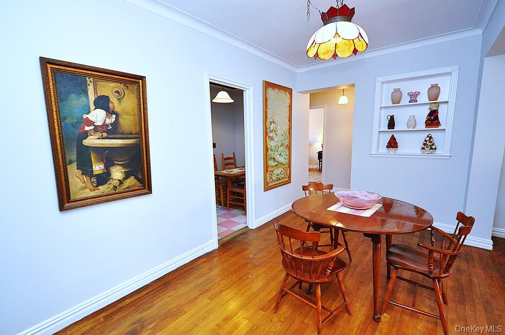 949 Palmer Road, Unit 6H Bronxville, NY 10708 - Photo 21 of 48 a view of a dining room with furniture and wooden floor