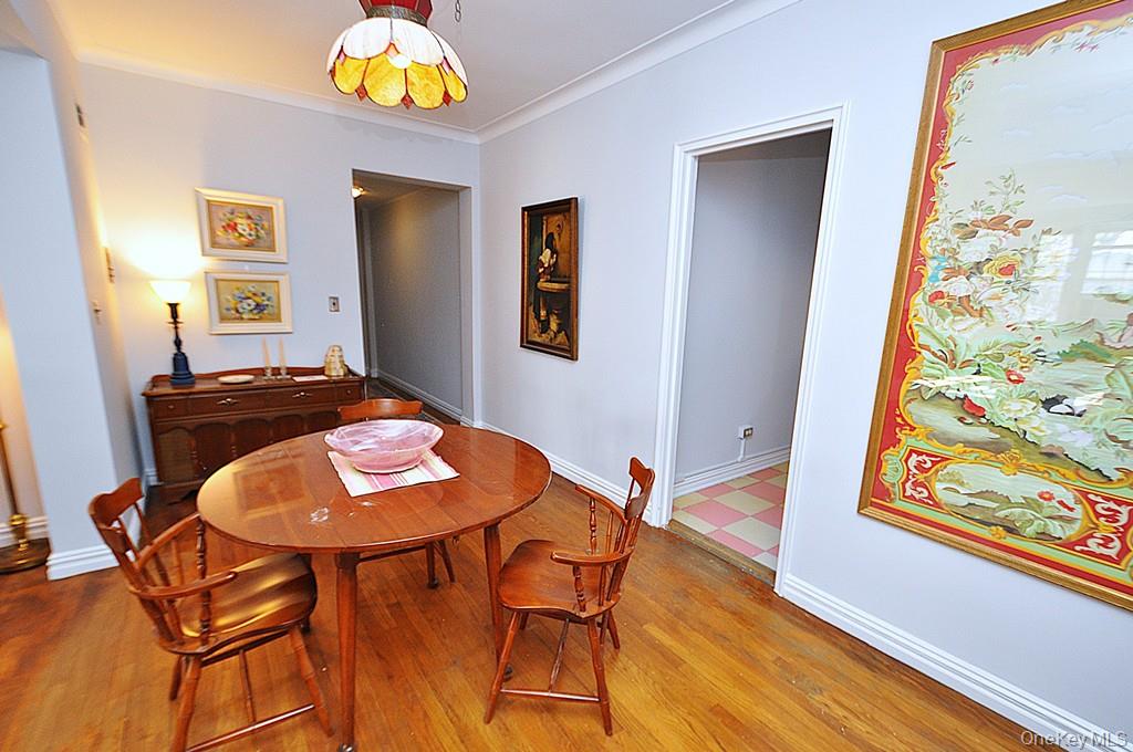949 Palmer Road, Unit 6H Bronxville, NY 10708 - Photo 22 of 48 a view of a dining room with furniture and wooden floor