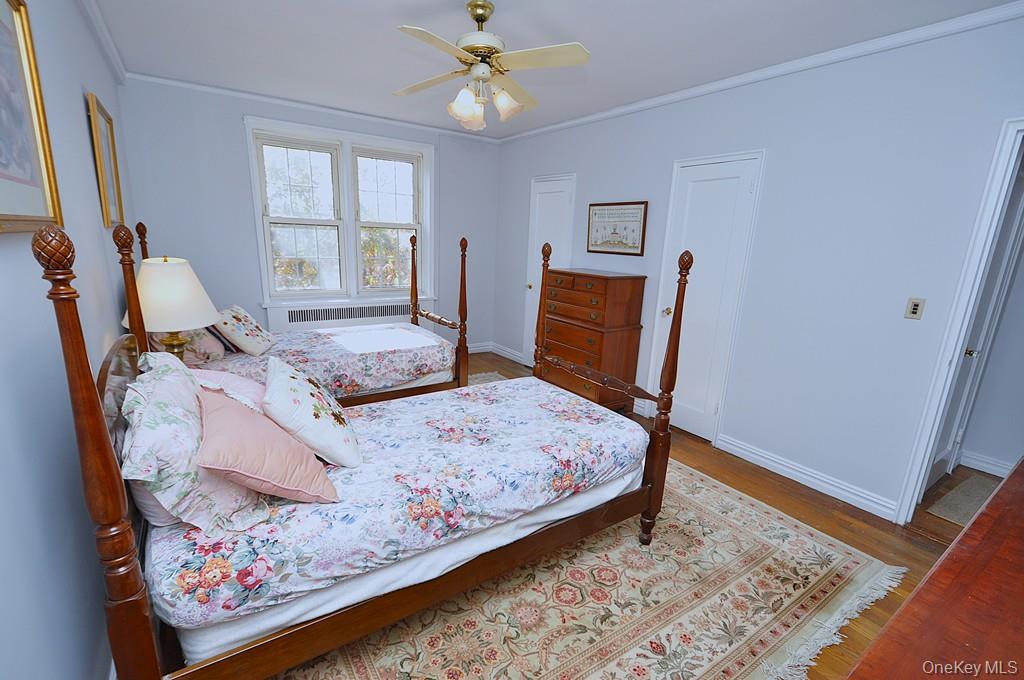 949 Palmer Road, Unit 6H Bronxville, NY 10708 - Photo 27 of 48 a bedroom with bed and wooden floor