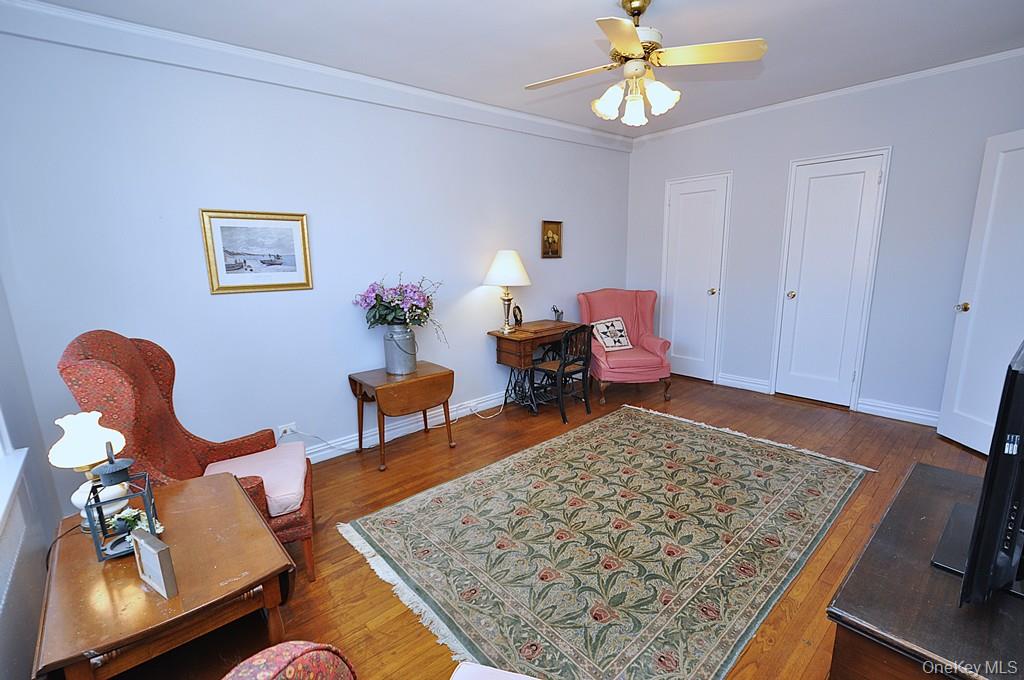 949 Palmer Road, Unit 6H Bronxville, NY 10708 - Photo 32 of 48 a living room with furniture rug and window
