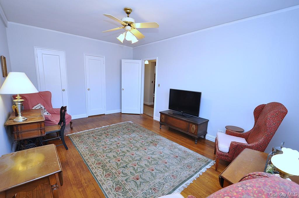 949 Palmer Road, Unit 6H Bronxville, NY 10708 - Photo 33 of 48 a living room with furniture and a flat screen tv