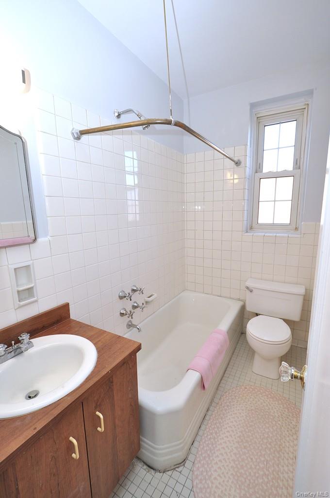949 Palmer Road, Unit 6H Bronxville, NY 10708 - Photo 35 of 48 a bathroom with a sink a toilet and shower