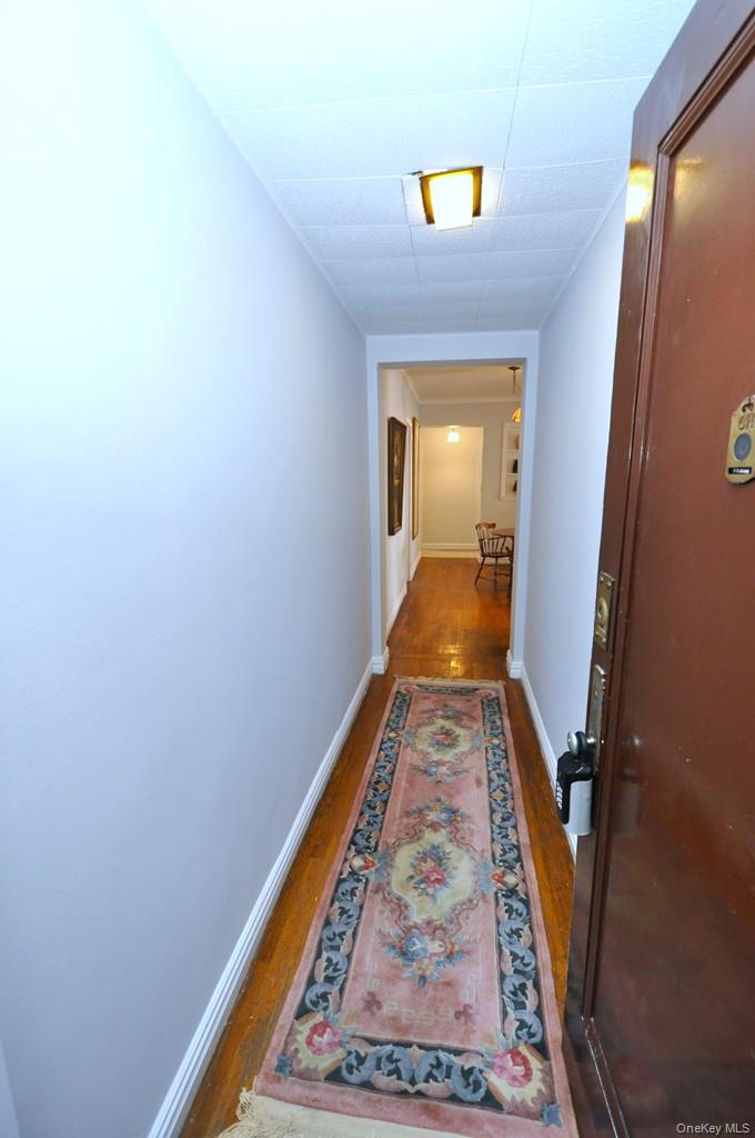 949 Palmer Road, Unit 6H Bronxville, NY 10708 - Photo 37 of 48 a view of a hallway with wooden floor