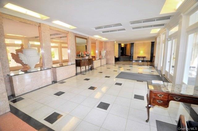 949 Palmer Road, Unit 6H Bronxville, NY 10708 - Photo 5 of 48 a large white kitchen with a large window