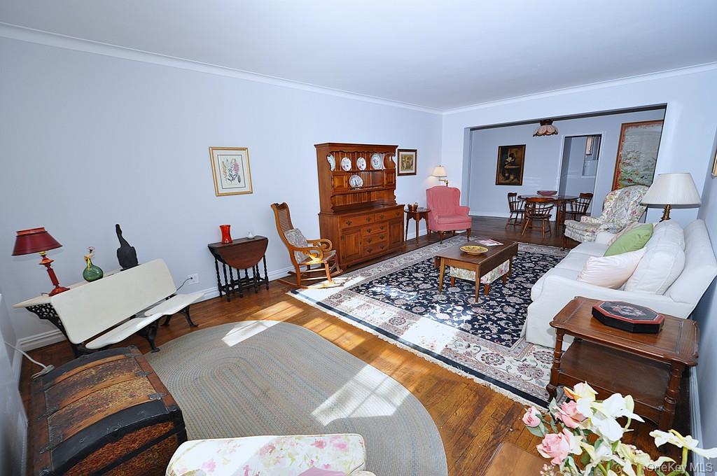 949 Palmer Road, Unit 6H Bronxville, NY 10708 - Photo 8 of 48 a living room with furniture and a flat screen tv