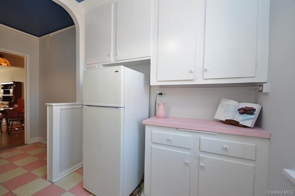 949 Palmer Road, Unit 6H Bronxville, NY 10708 - Photo 10 of 48 a kitchen with stainless steel appliances white cabinets and a refrigerator