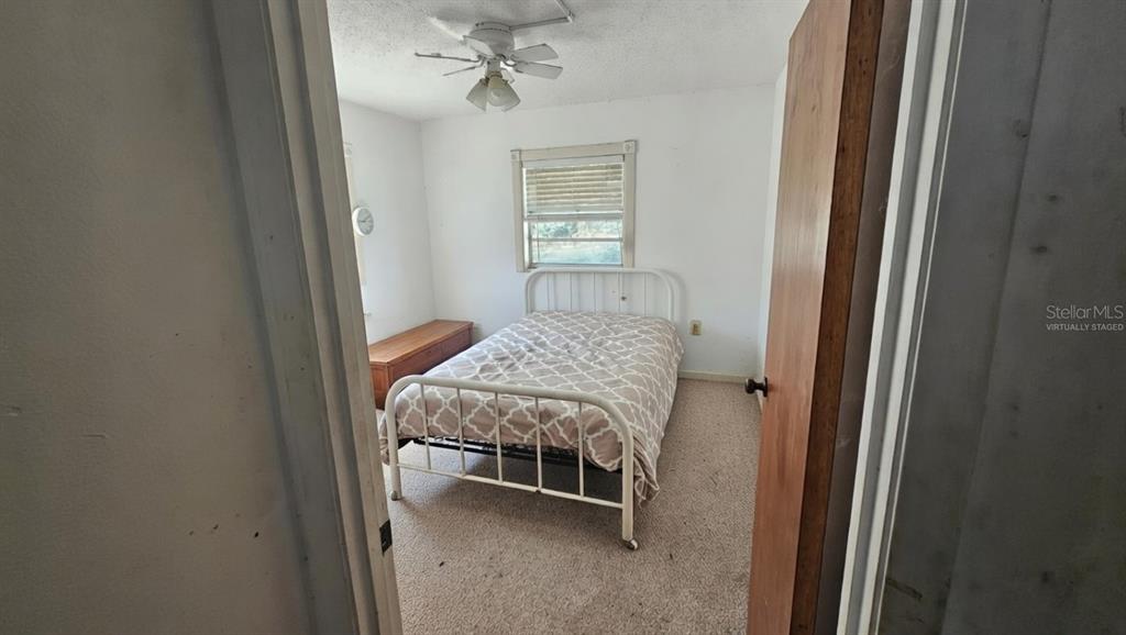 43734 West Lane Paisley, FL 32767 - Photo 12 of 38 a bedroom with a bed and a window