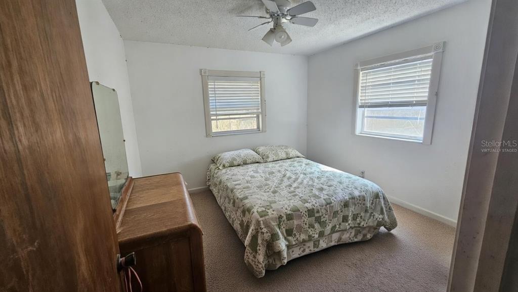 43734 West Lane Paisley, FL 32767 - Photo 14 of 38 a bedroom with a bed and window