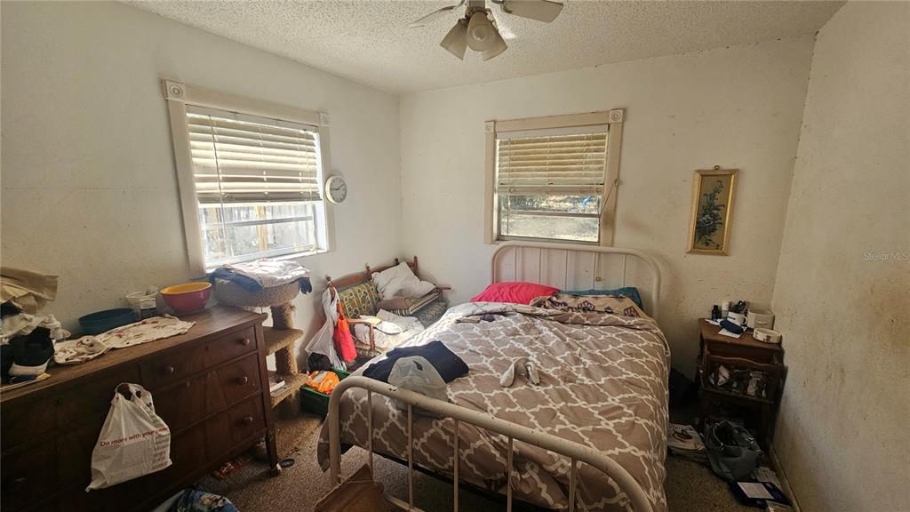 43734 West Lane Paisley, FL 32767 - Photo 15 of 38 a bedroom with a bed and a window