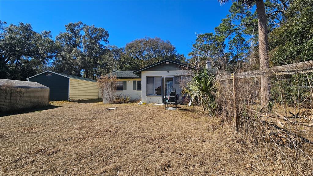 43734 West Lane Paisley, FL 32767 - Photo 27 of 38 a front view of a house with a yard and garage