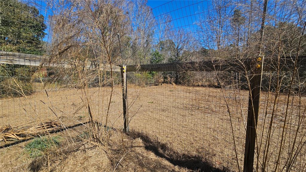 43734 West Lane Paisley, FL 32767 - Photo 28 of 38 a view of a yard covered with snow in front of house