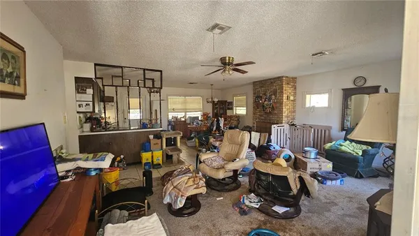 a living room with furniture a chandelier
