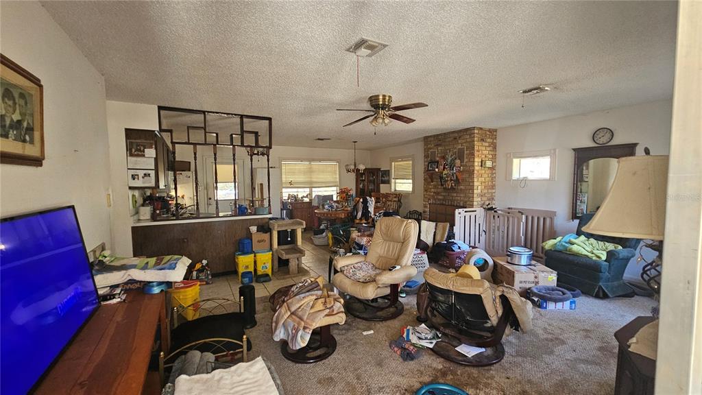 43734 West Lane Paisley, FL 32767 - Photo 3 of 38 a living room with furniture a chandelier
