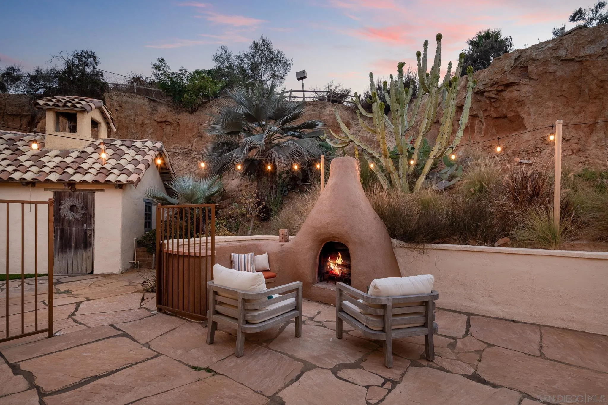 1243 Crest Drive Encinitas, CA 92024 - Photo 11 of 47 a backyard of a house with outdoor seating