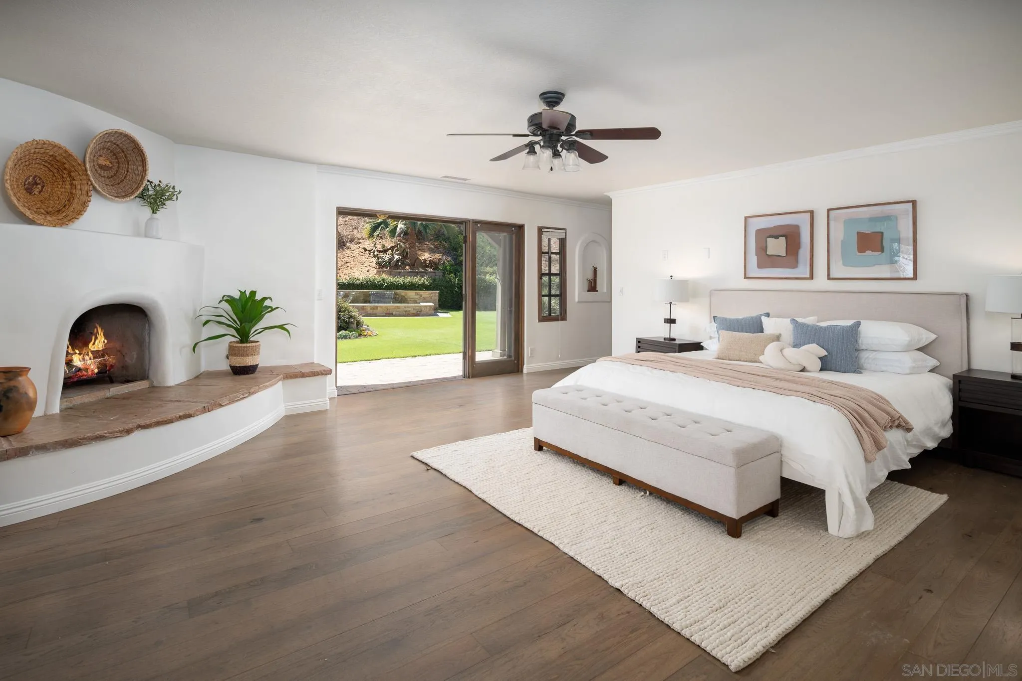 1243 Crest Drive Encinitas, CA 92024 - Photo 13 of 47 a bedroom with a bed and a fireplace