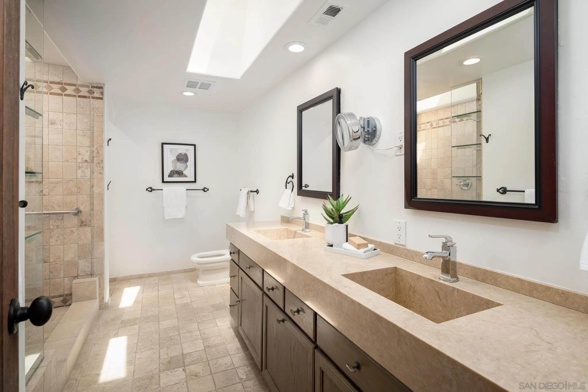 1243 Crest Drive Encinitas, CA 92024 - Photo 15 of 47 a bathroom with a sink double vanity and a mirror