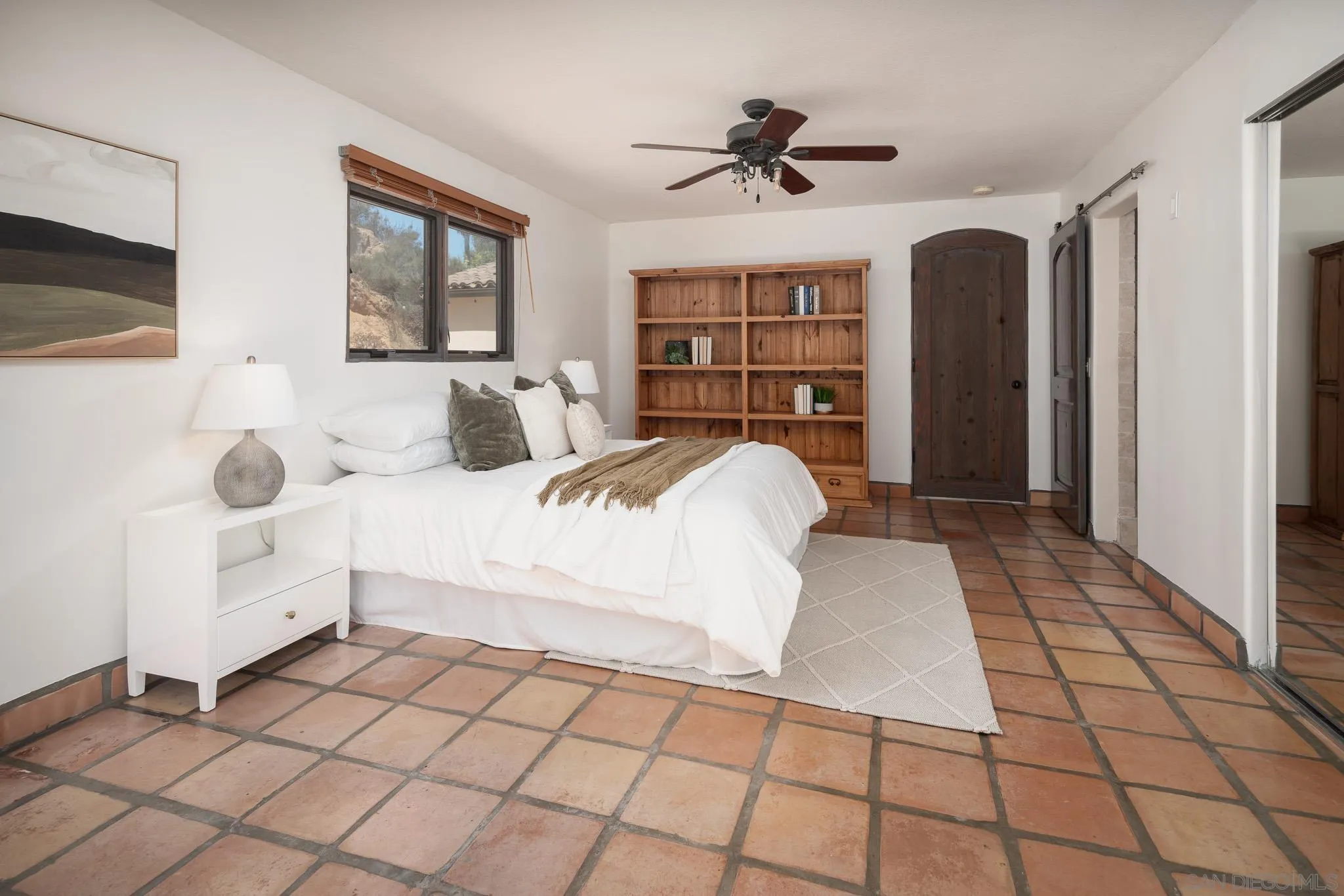 1243 Crest Drive Encinitas, CA 92024 - Photo 16 of 47 a living room with a bed and a flat screen tv