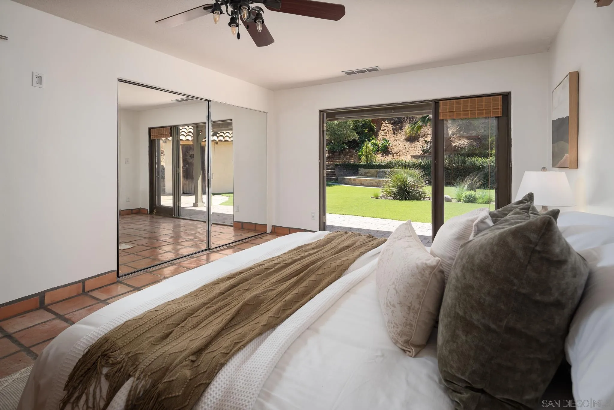 1243 Crest Drive Encinitas, CA 92024 - Photo 17 of 47 a bedroom with a bed and a large window with pool view