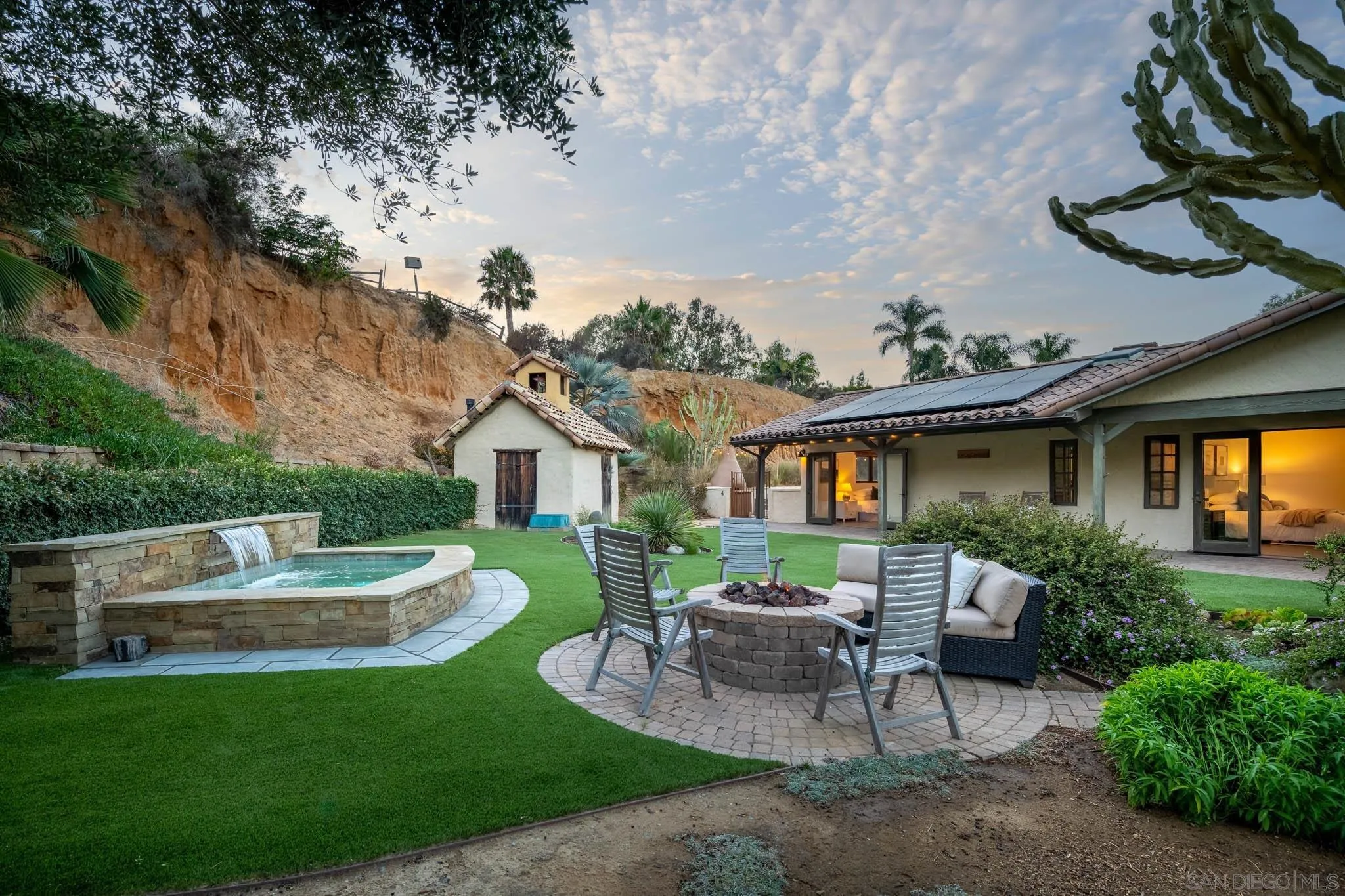 1243 Crest Drive Encinitas, CA 92024 - Photo 22 of 47 a backyard of a house with table and chairs