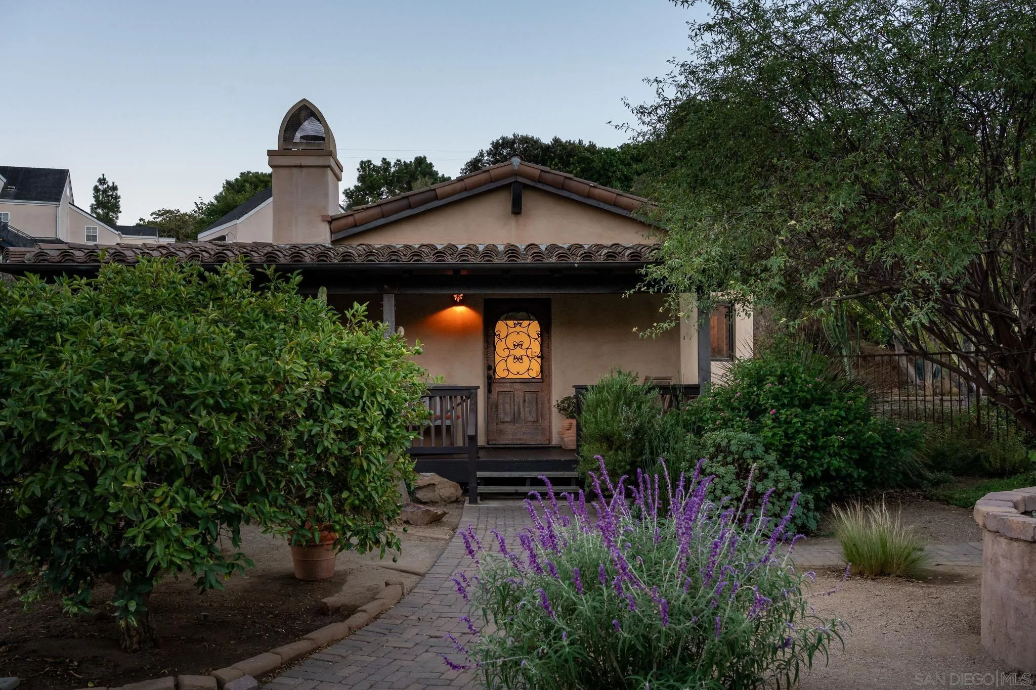1243 Crest Drive Encinitas, CA 92024 - Photo 28 of 47 a front view of a house with garden