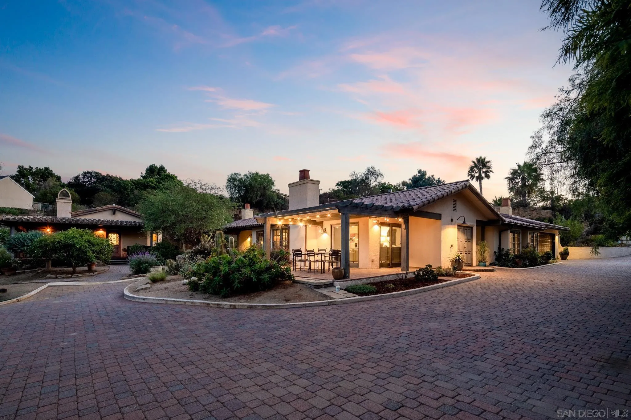 1243 Crest Drive Encinitas, CA 92024 - Photo 38 of 47 a front view of a house with a yard and lake view