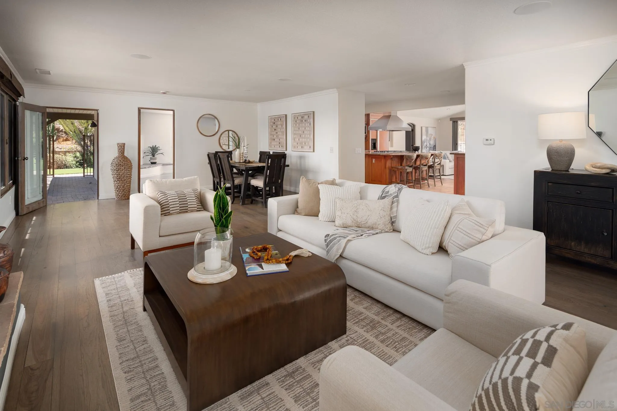 1243 Crest Drive Encinitas, CA 92024 - Photo 4 of 47 a living room with furniture kitchen view and a wooden floor