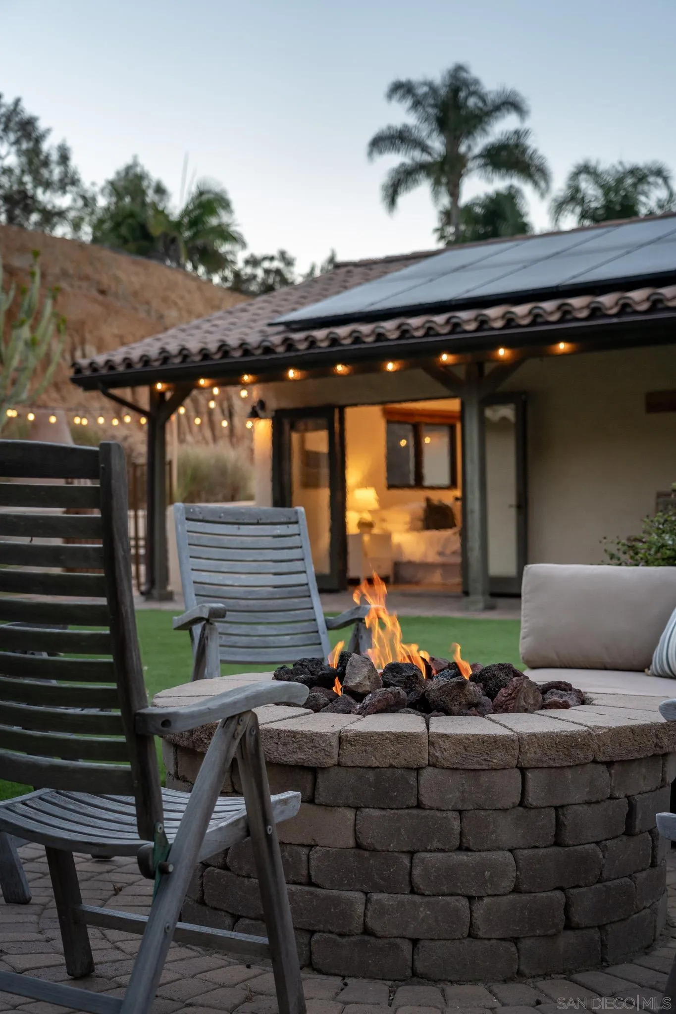 1243 Crest Drive Encinitas, CA 92024 - Photo 43 of 47 a living room with chairs and a fireplace