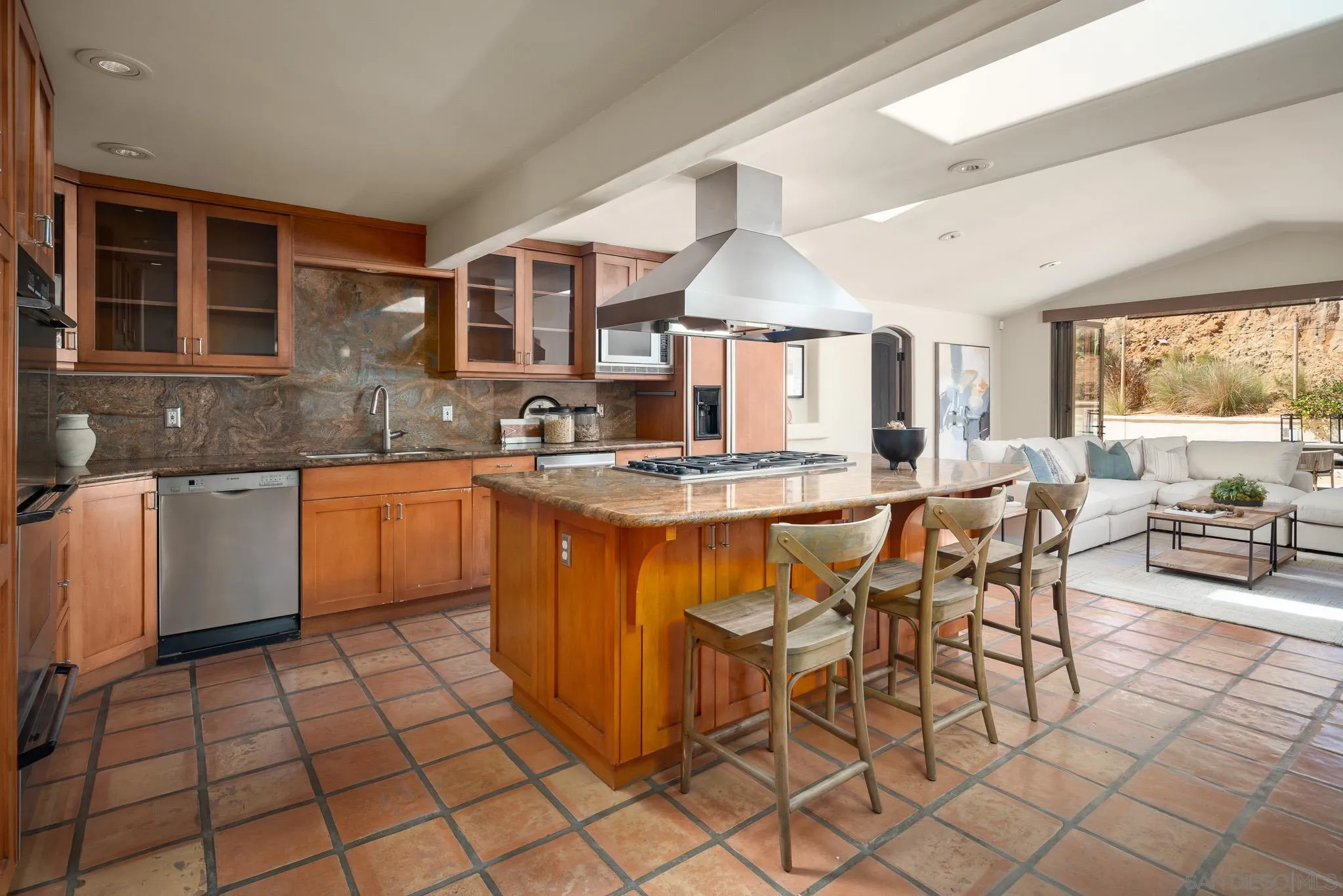 1243 Crest Drive Encinitas, CA 92024 - Photo 7 of 47 a kitchen with a sink and cabinets
