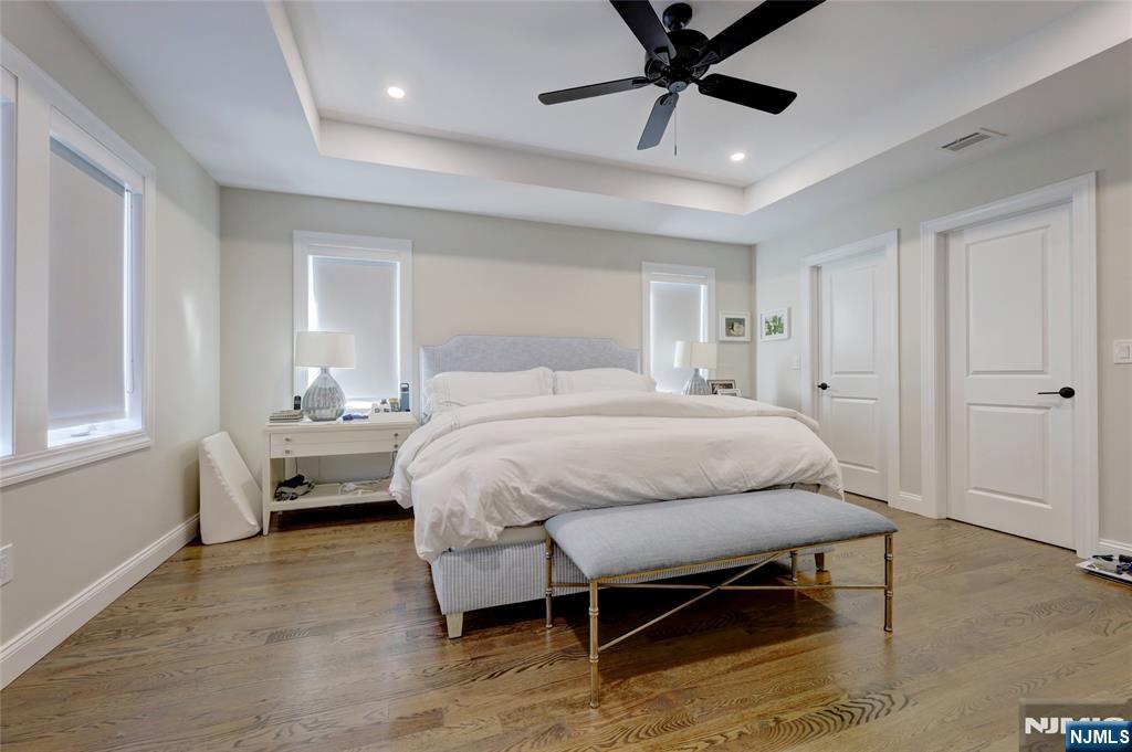 63 Sunset Lane Tenafly, NJ 07670 - Photo 20 of 20 a bedroom with a bed and a chandelier