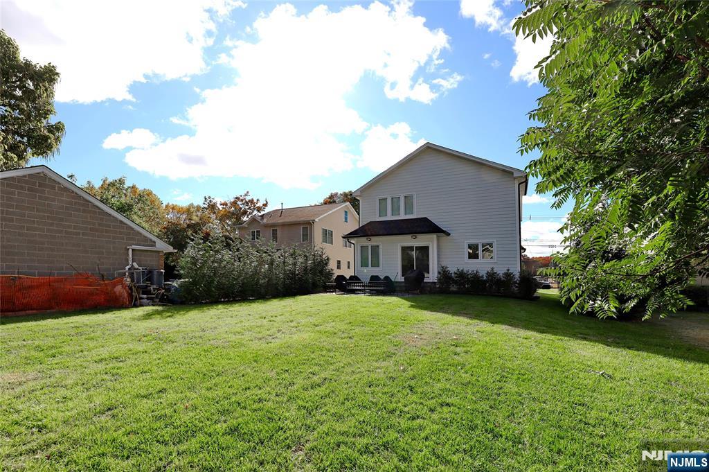 63 Sunset Lane Tenafly, NJ 07670 - Photo 3 of 20 a view of a house with a yard and pathway