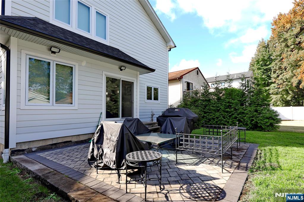 63 Sunset Lane Tenafly, NJ 07670 - Photo 4 of 20 a view of a house with backyard and sitting area