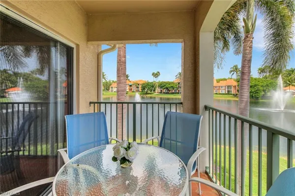 a view of a balcony with furniture