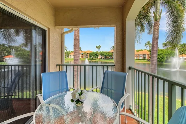 a view of a balcony with furniture