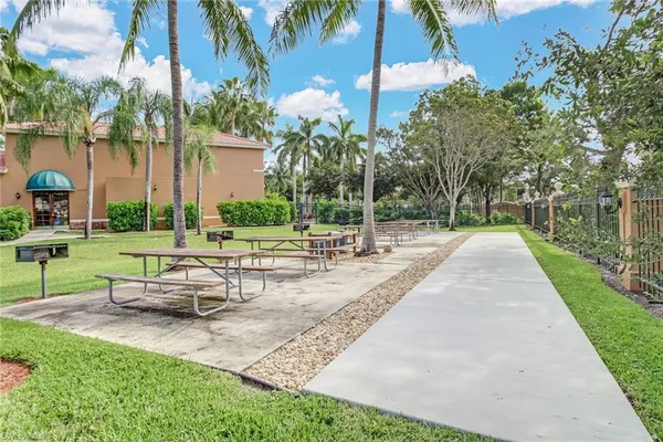 a view of a park with sitting area