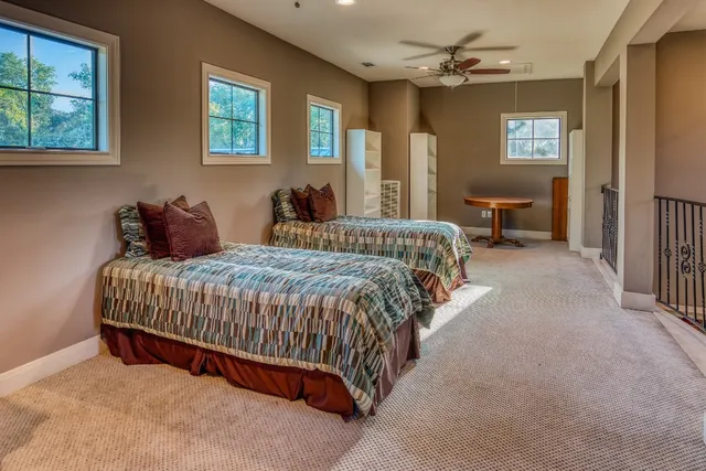 a bedroom with bed and window