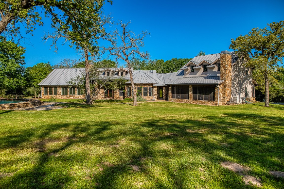 6925 South Sycamore Crossing Road Bellville, TX 77418 - Photo 29 of 40 a front view of a building with garden