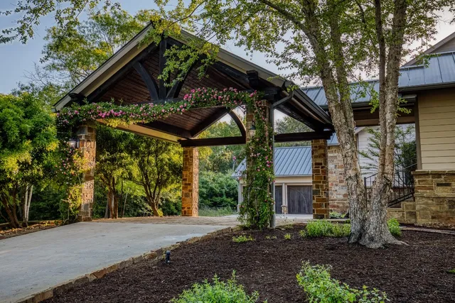 an aerial view of a house with a garden