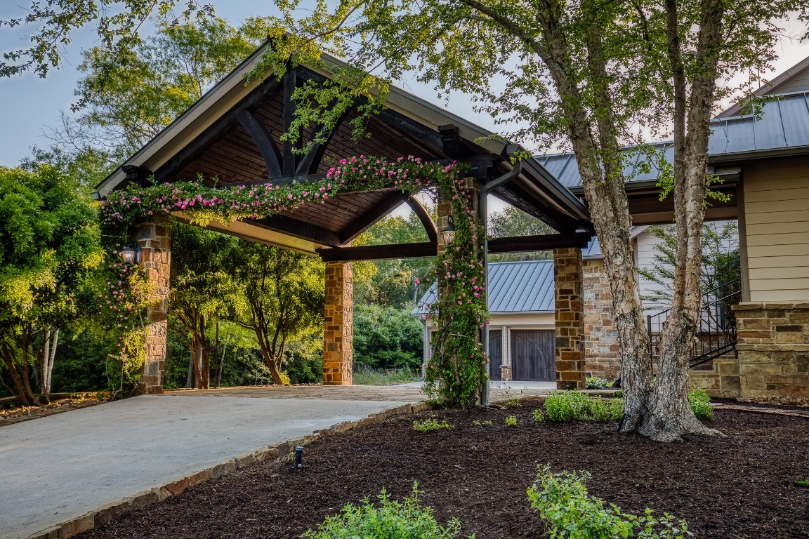 6925 South Sycamore Crossing Road Bellville, TX 77418 - Photo 30 of 40 a front view of a house with a garden