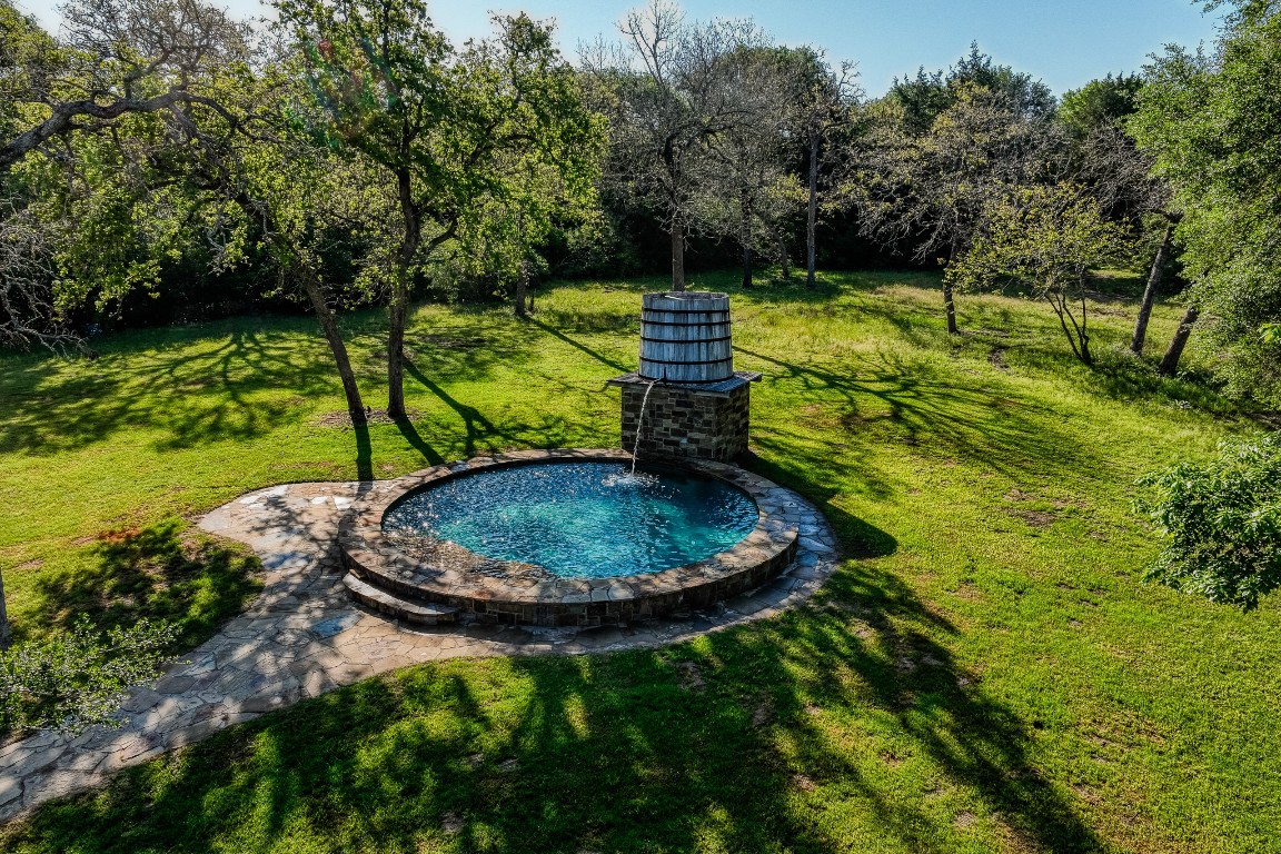 6925 South Sycamore Crossing Road Bellville, TX 77418 - Photo 3 of 40 a view of a backyard with swimming pool