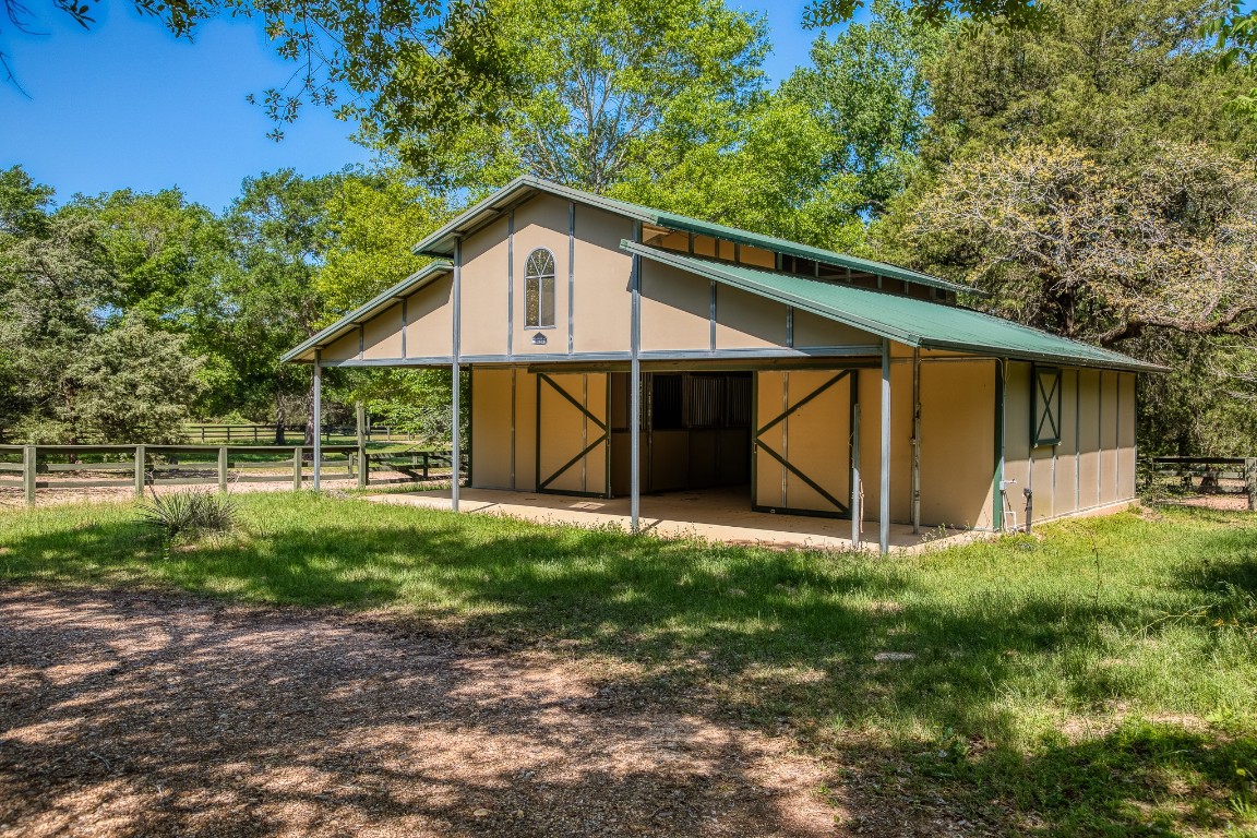 6925 South Sycamore Crossing Road Bellville, TX 77418 - Photo 36 of 40 a view of a house with backyard