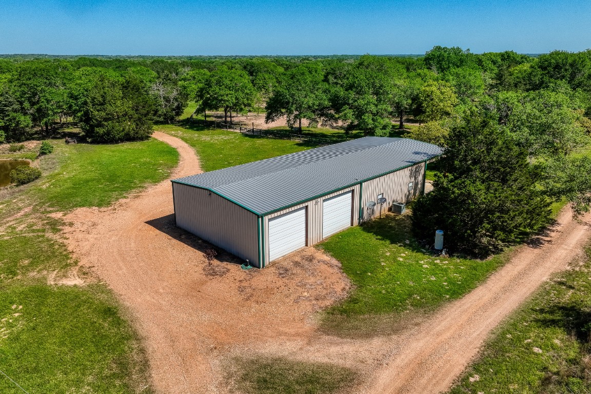 6925 South Sycamore Crossing Road Bellville, TX 77418 - Photo 37 of 40 a view of a house with a yard and street