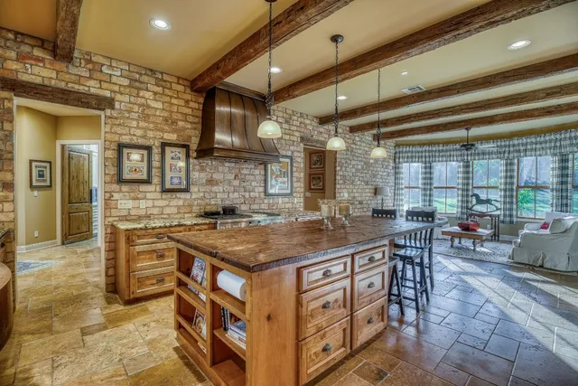 a kitchen with cabinets and outdoor seating