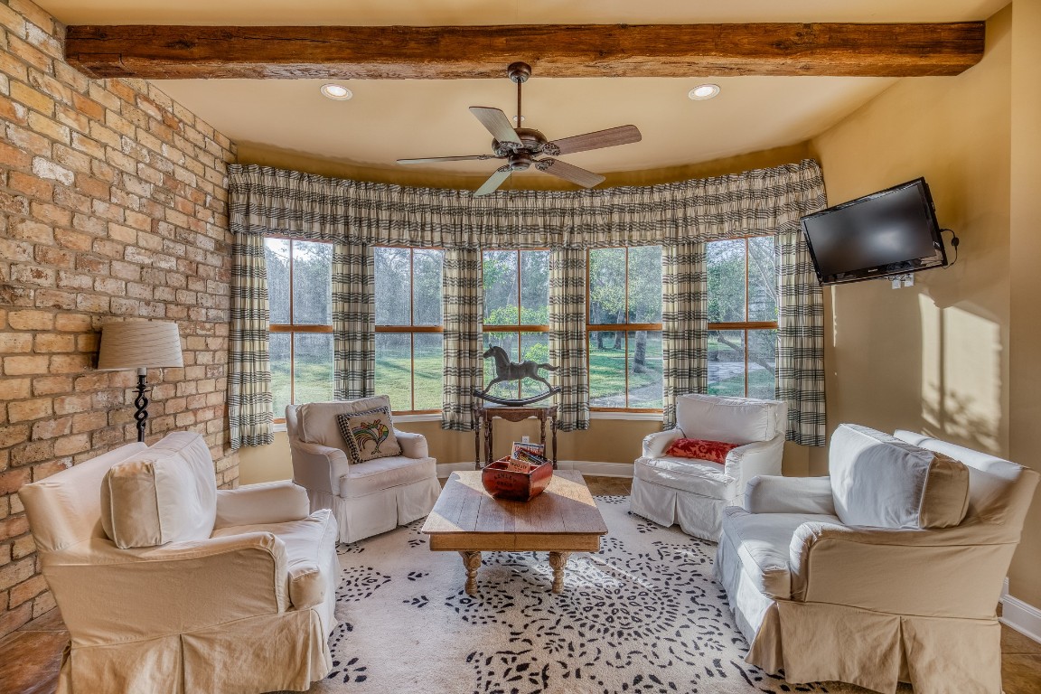 6925 South Sycamore Crossing Road Bellville, TX 77418 - Photo 8 of 40 a living room with furniture and floor to ceiling windows