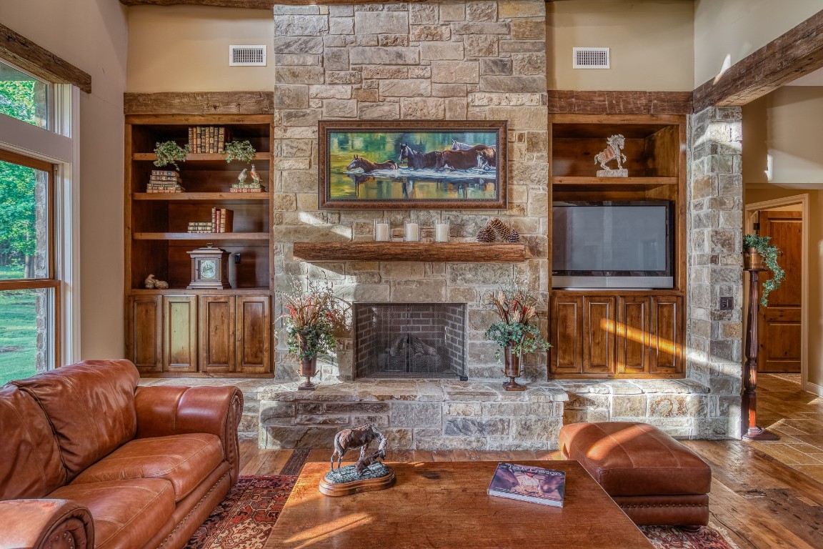 6925 South Sycamore Crossing Road Bellville, TX 77418 - Photo 9 of 40 a living room with furniture and a fireplace