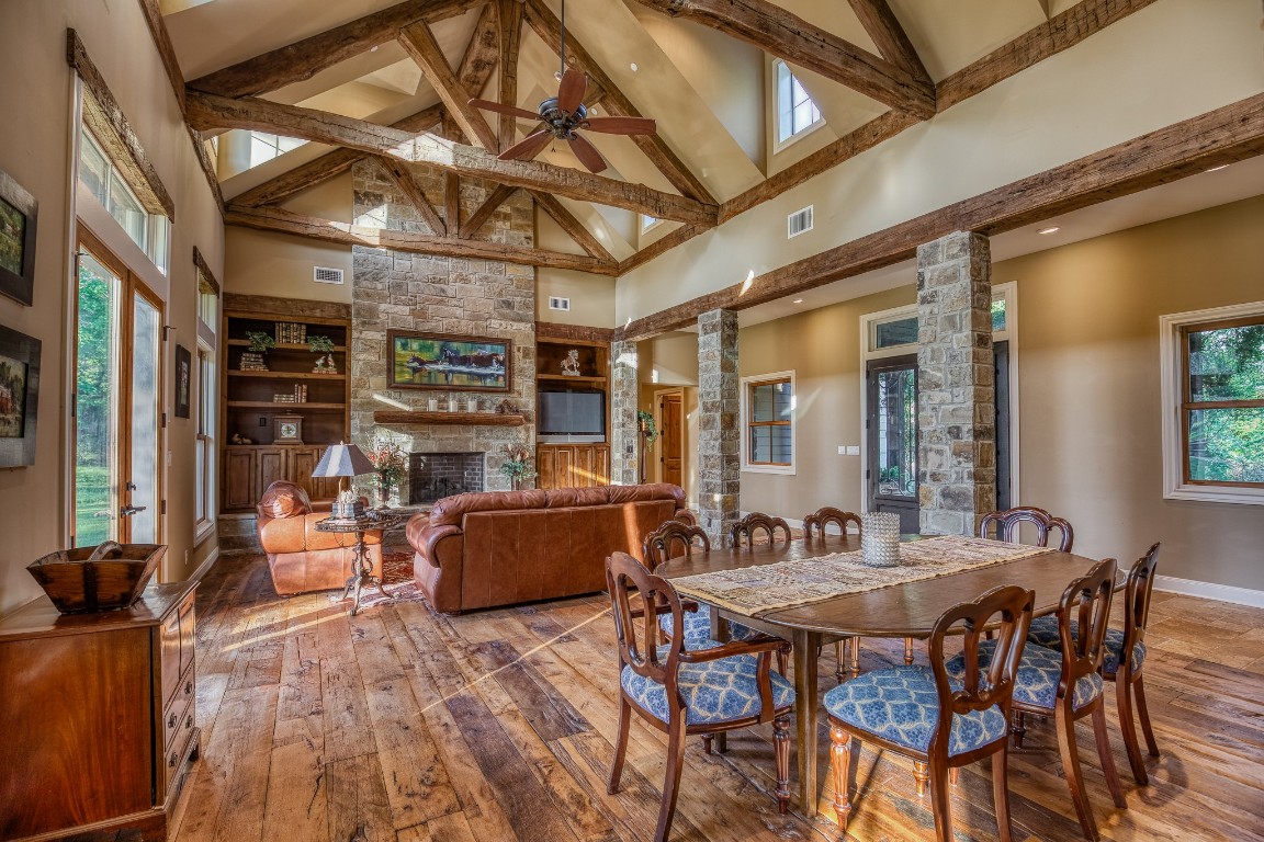 6925 South Sycamore Crossing Road Bellville, TX 77418 - Photo 10 of 40 a view of a dining room with furniture window and wooden floor