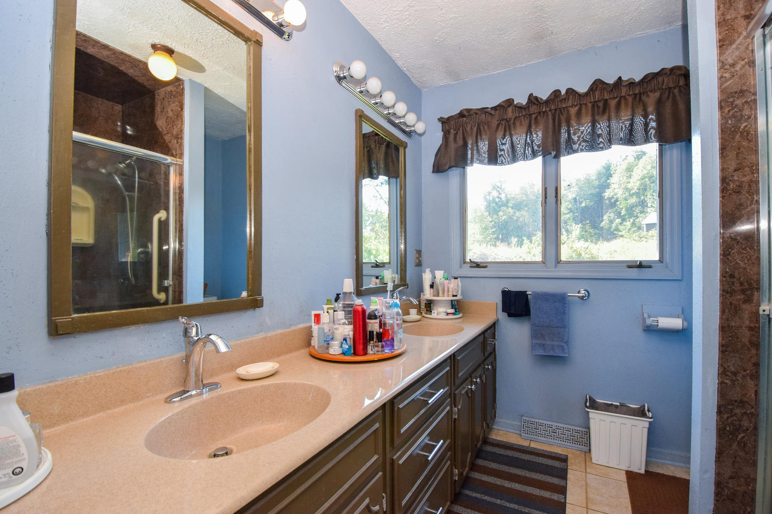 211 Rhododendron Road Callaway, VA 24067 - Photo 24 of 48 a bathroom with a sink and a mirror