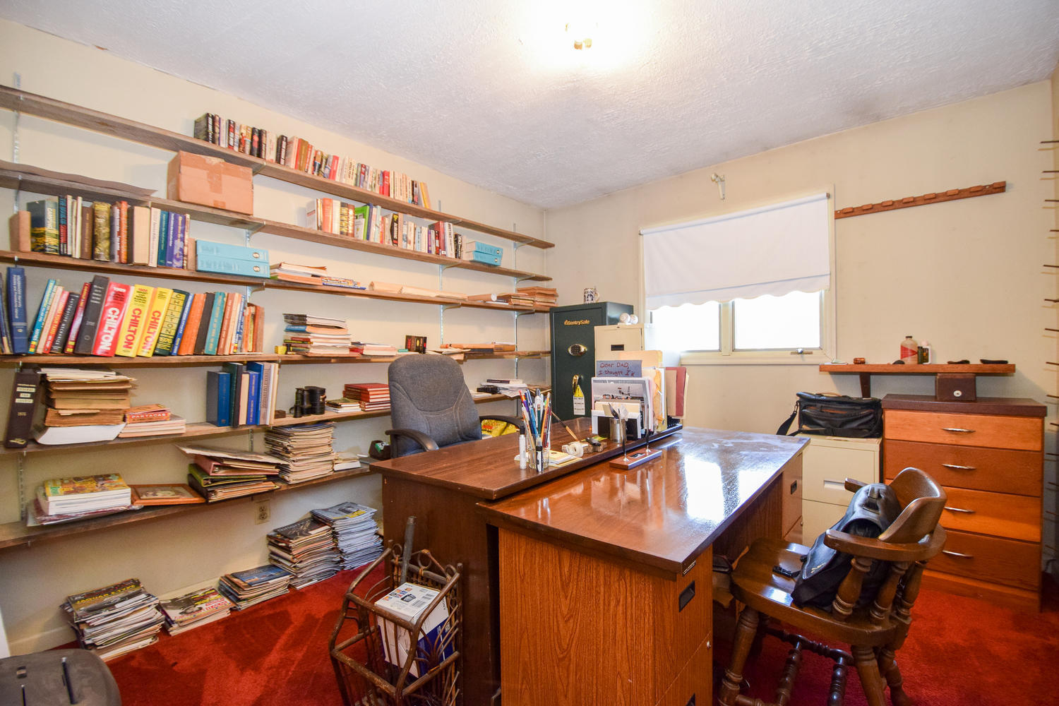 211 Rhododendron Road Callaway, VA 24067 - Photo 26 of 48 a room with furniture and a book shelf