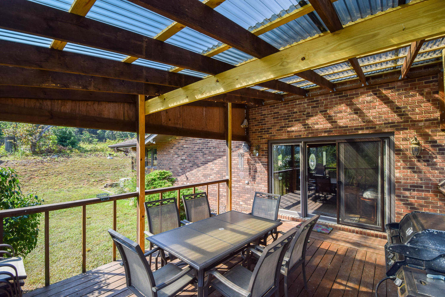 211 Rhododendron Road Callaway, VA 24067 - Photo 29 of 48 a view of a balcony with table and chairs